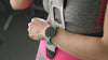 Woman trying on a band watch protector